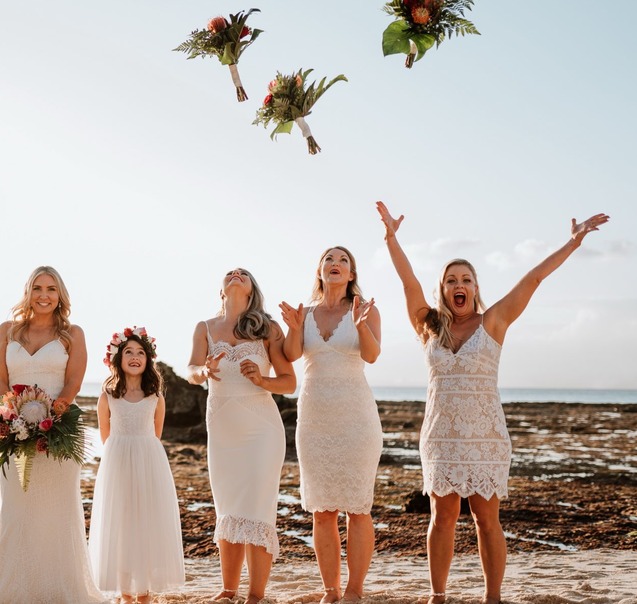Bouquet toss on the beach